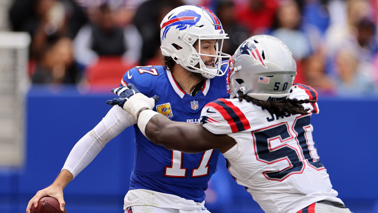 ORCHARD PARK, NEW YORK - OCTOBER 04: Josh Allen #17 of the Buffalo Bills under pressure from Gabe Jacas #50 of the New England Patriots during the third quarter at Highmark Stadium on October 04, 2026 in Orchard Park, New York.
