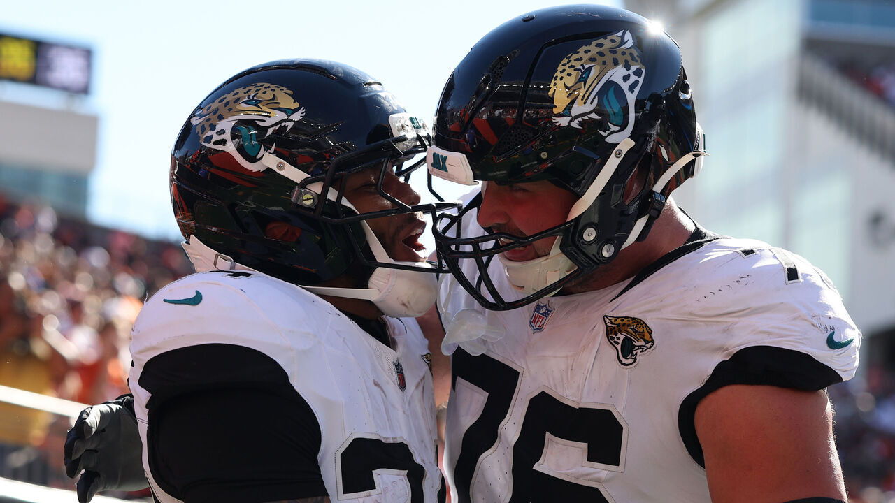 CINCINNATI, OHIO - OCTOBER 04: Chris Rodriguez Jr. #24 and Ezra Cleveland #76 of the Jacksonville Jaguars celebrate after scoring a touchdown during the fourth quarter of the game against the Cincinnati Bengals at Paycor Stadium on October 04, 2026 in Cincinnati, Ohio.