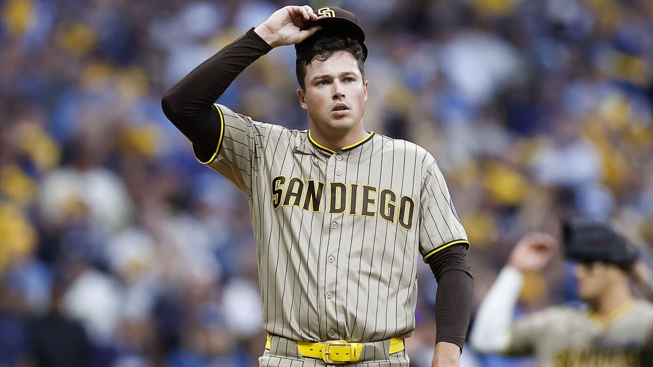 Milwaukee, Wisconsin - October 04: Mason Miller #22 of the San Diego Padres adjusts his cap after walking Gary Sanchez #99 of the Milwaukee Brewers during the ninth inning of Game 2 of the National League Division Series at American Family Field on Sunday, Oct. 4, 2026 in Milwaukee, Wisconsin.