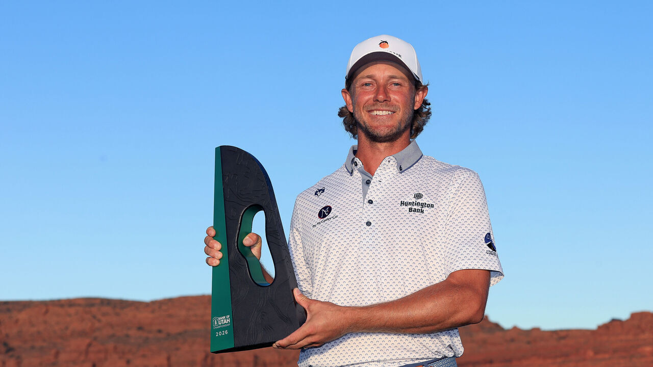 ST GEORGE, UTAH - OCTOBER 04: Austin Smotherman of the United States poses with the winner's trophy after winning the Bank of Utah Championship 2026 at Black Desert Resort on October 04, 2026 in Ivins, Utah.