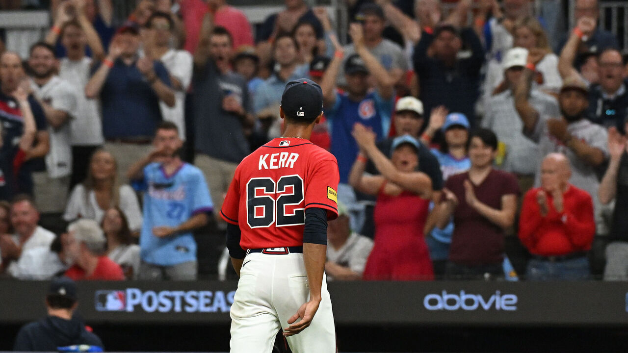 ATLANTA, GEORGIA - OCTOBER 01: Ray Kerr #62 of the Atlanta Braves walks to the dugout against the Philadelphia Phillies during the fourth inning in game three of the National League Wild Card Series at Truist Park on October 01, 2026 in Atlanta, Georgia.