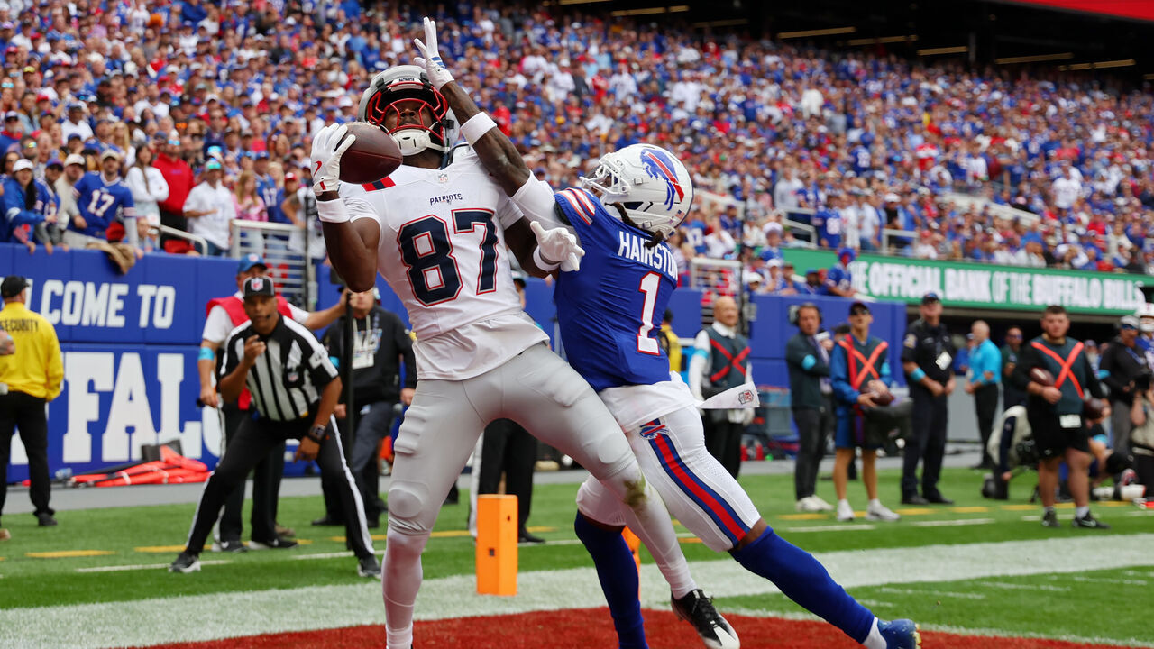 ORCHARD PARK, NEW YORK - OCTOBER 04: Romeo Doubs #87 of the New England Patriots makes a catch for a touchdown against Maxwell Hairston #1 of the Buffalo Bills during the third quarter at Highmark Stadium on October 04, 2026 in Orchard Park, New York.