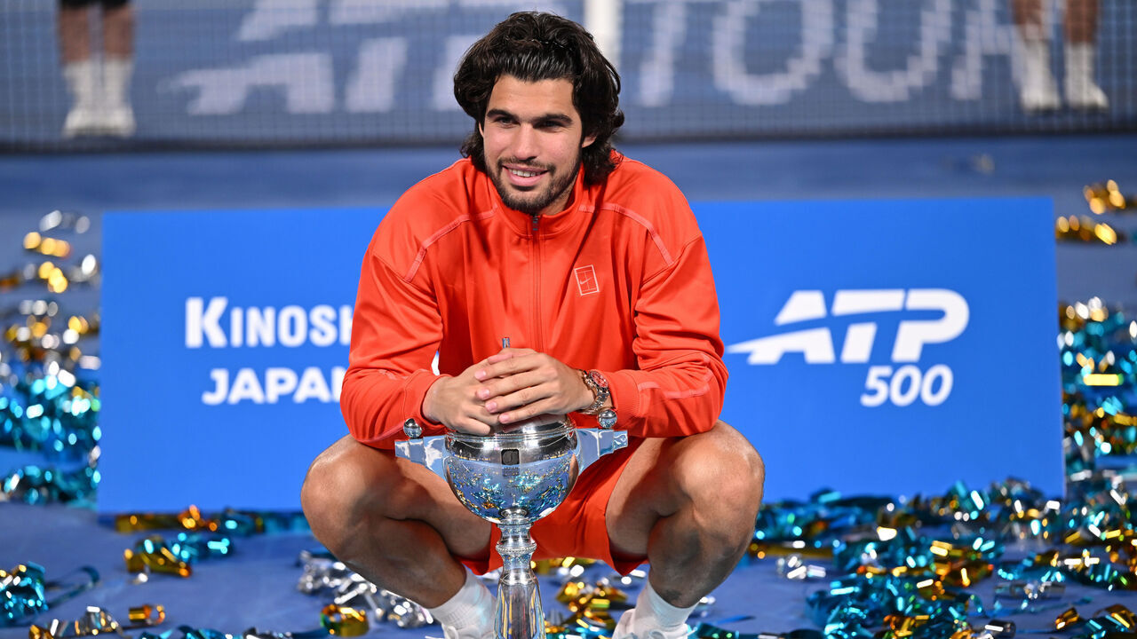 TOKYO, JAPAN - OCTOBER 06: Winner Carlos Alcaraz of Spain celebrates with the trophy after winning against Jiri Lehecka of Czechia in the Singles Final on day seven of Kinoshita Group Japan Open at Ariake Tennis Park on October 6, 2026 in Tokyo, Japan.