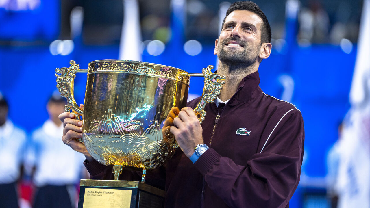 BEIJING, CHINA - OCTOBER 06: Novak Djokovic of Serbia poses with the trophy during the medal ceremony after winning the Men's Singles final match against Alex De Minaur of Australia on day seven of China Open at the National Tennis Center on October 06, 2026 in Beijing, China.