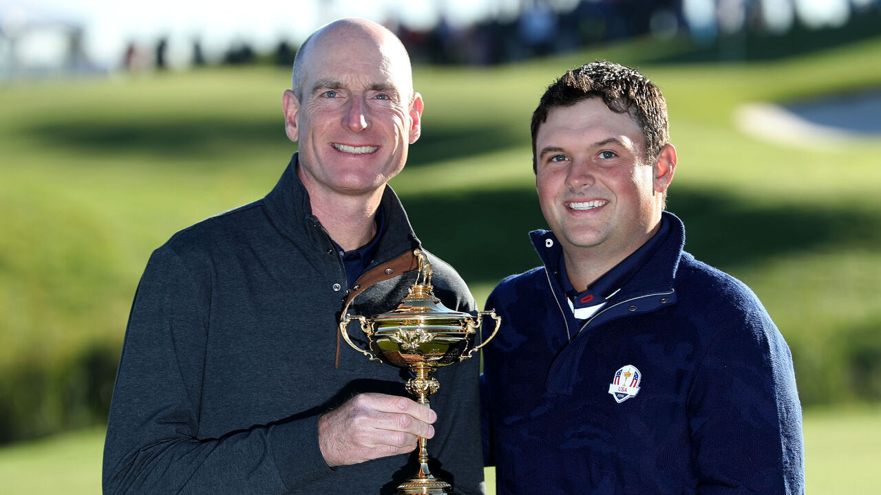 PARIS, FRANCE - SEPTEMBER 26: Jim Furyk the United States team Captain holds the Ryder Cup with Patrick Reed during the official United States team photocall ahead of the 2018 Ryder Cup at Le Golf National on September 26, 2018 in Paris, France.
