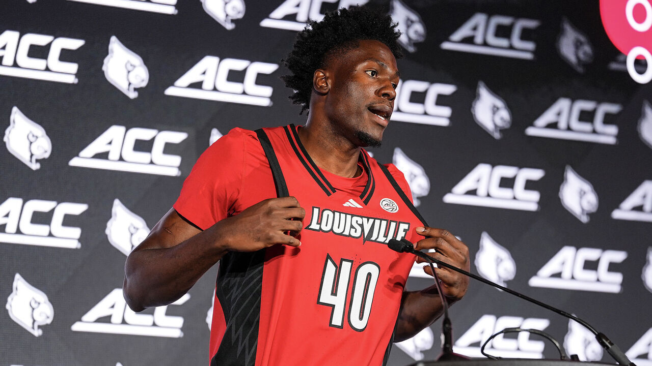 CHARLOTTE, NORTH CAROLINA - OCTOBER 06: Forward Flory Bidunga #40 of the Louisville Cardinals speaks during the ACC basketball tip off at Hilton Charlotte Uptown on October 06, 2026 in Charlotte, North Carolina.