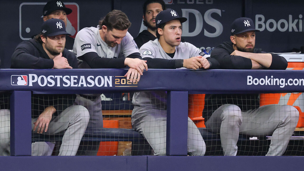 ST. PETERSBURG, FL - OCTOBER 05: Members of the New York Yankees look on from the dugout in the ninth inning during Game Two of the American League Division Series presented by Booking.com between the New York Yankees and the Tampa Bay Rays at Tropicana Field on Monday, October 5, 2026 in St. Petersburg, Florida.