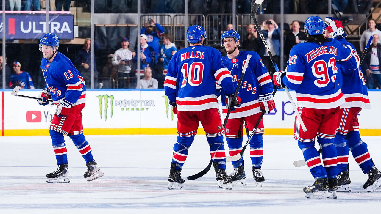 NEW YORK, NEW YORK - OCTOBER 06: Alexis Lafreniere #13 of the New York Rangers celebrates with teammates after scoring a goal during the third period against the New York Islanders at Madison Square Garden on October 6, 2026 in New York City.