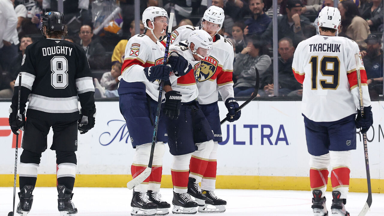 LOS ANGELES, CALIFORNIA - OCTOBER 06: Brad Marchand #63 of the Florida Panthers is helped off the ice with an injury against the Los Angeles Kings during the second period at Crypto.com Arena on October 06, 2026 in Los Angeles, California.