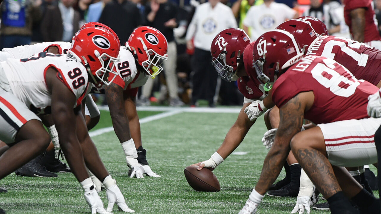 ATLANTA, GA - DECEMBER 06: The Georgia Bulldogs and the Alabama Crimson Tide line up across from each other during the SEC Championship Game between the Georgia Bulldogs and the Alabama Crimson Tide on December 06, 2025, at Mercedes-Benz Stadium in Atlanta, Ga.