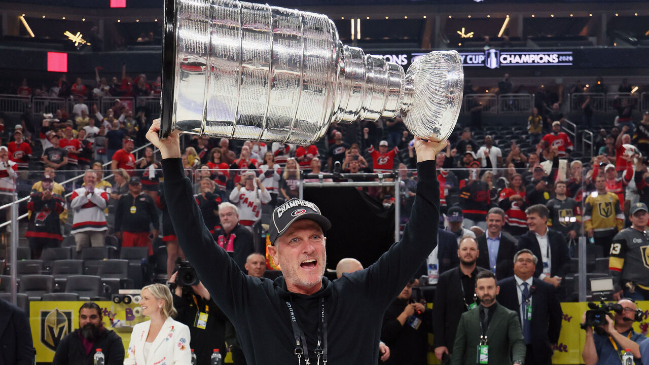 LAS VEGAS, NEVADA - JUNE 14: Carolina Hurricanes owner Tom Dundon holds the Stanley Cup following the win against the Vegas Golden Knights in Game Six of the 2026 NHL Stanley Cup Final at T-Mobile Arena on June 14, 2026 in Las Vegas, Nevada.