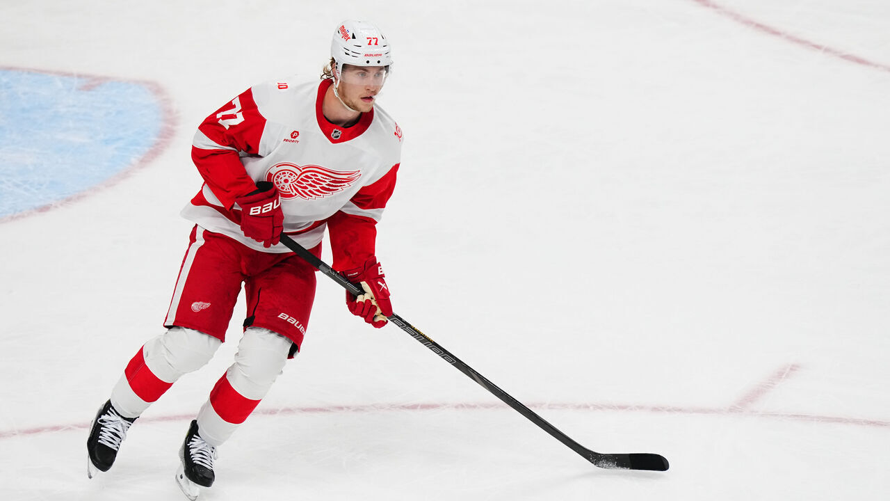 BUFFALO, NEW YORK - MARCH 27: Simon Edvinsson #77 of the Detroit Red Wings handles the puck during the second period of an NHL game against the Buffalo Sabres on March 27, 2026 at KeyBank Center in Buffalo, New York.