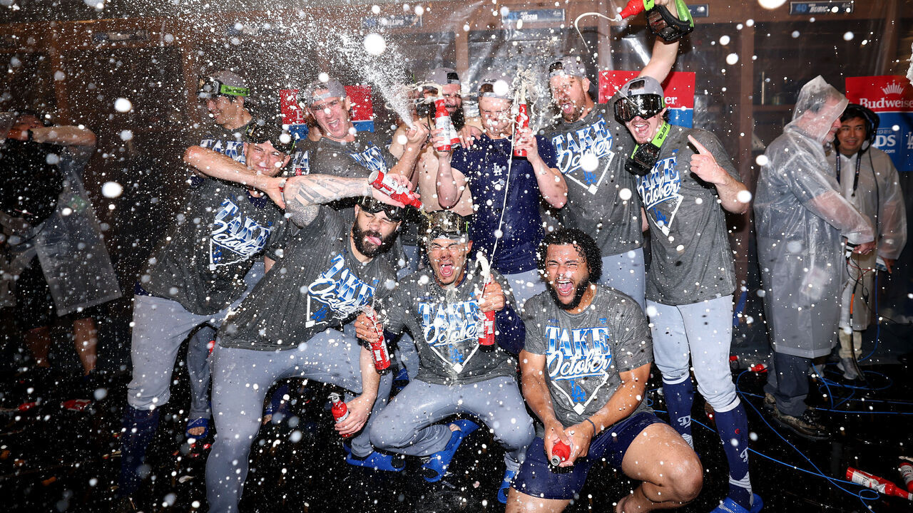 ATLANTA, GEORGIA - OCTOBER 07: The Los Angeles Dodgers celebrate defeating the Atlanta Braves in game four of the National League Division Series at Truist Park on October 07, 2026 in Atlanta, Georgia.