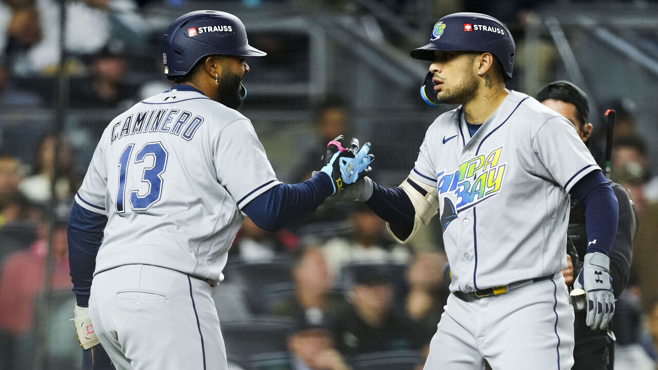 NEW YORK, NY - OCTOBER 07: Victor Mesa Jr. #25 of the Tampa Bay Rays celebrates with Junior Caminero #13 after hitting a two-run home run in the sixth inning during Game Three of the American League Division Series presented by Booking.com between the Tampa Bay Rays and the New York Yankees at Yankee Stadium on Wednesday, October 7, 2026 in New York, New York.