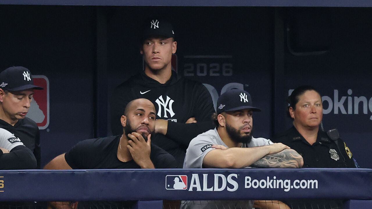 ST. PETERSBURG, FL - OCTOBER 05: Members of the New York Yankees look on from the dugout in the ninth inning during Game Two of the American League Division Series presented by Booking.com between the New York Yankees and the Tampa Bay Rays at Tropicana Field on Monday, October 5, 2026 in St. Petersburg, Florida.