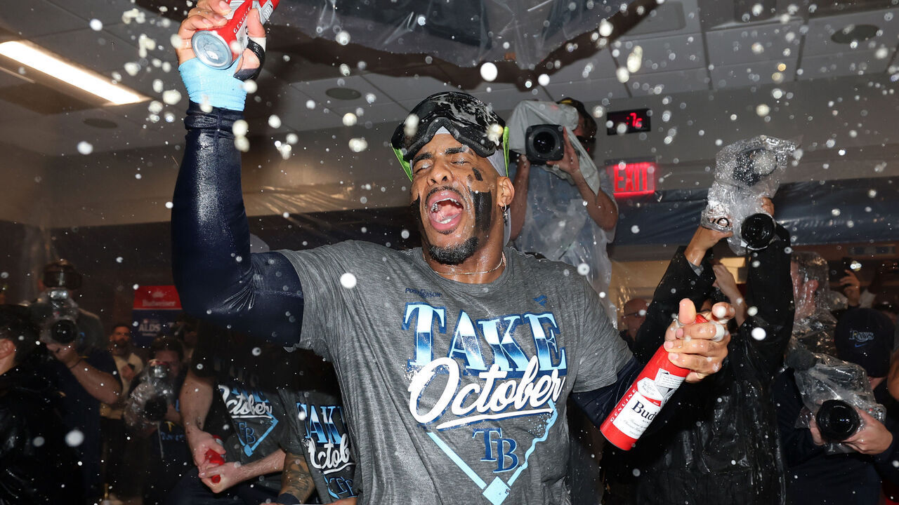 NEW YORK, NEW YORK - OCTOBER 07: Yandy Díaz #2 of the Tampa Bay Rays celebrates in the clubhouse after defeating the New York Yankees in game three of the American League Division Series at Yankee Stadium on October 07, 2026 in the Bronx borough of New York City.