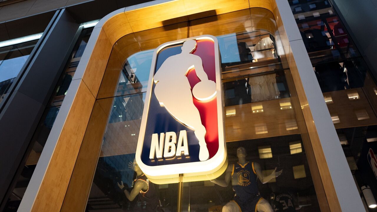 Illuminated NBA logo above the entrance to the NBA Store on Fifth Avenue, New York, New York, September 29, 2026.