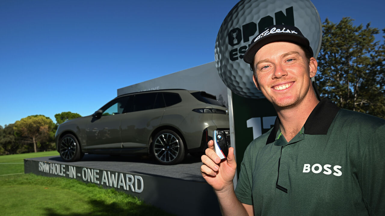MADRID, SPAIN - OCTOBER 08: Daniel Hillier of New Zealand poses with the BMW IX5 after winning the car following a hole in one on the 17th hole on day one of the Open de España presented by Madrid at Club de Campo Villa de Madrid on October 08, 2026 in Madrid, Spain.
