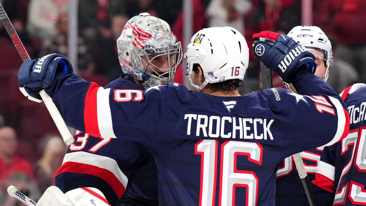MONTREAL, QUEBEC - FEBRUARY 15: Connor Hellebuyck #37 of Team United States celebrates with Vincent Trocheck #16 after their 3-1 win in the 4 Nations Face-Off game between the United States and Canada at Bell Centre on February 15, 2025 in Montreal, Quebec.