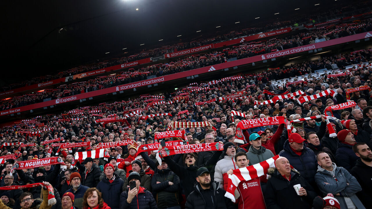 LIVERPOOL, ENGLAND - FEBRUARY 08: Liverpool fans show their support in stands by holding up scarfs prior to the Premier League match between Liverpool and Manchester City at Anfield on February 08, 2026 in Liverpool, England.