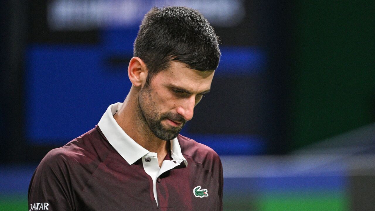 Serbia's Novak Djokovic rests between games against Poland's Hubert Hurkacz during their men's singles match at the Shanghai Masters tennis tournament in Shanghai on October 9, 2026.