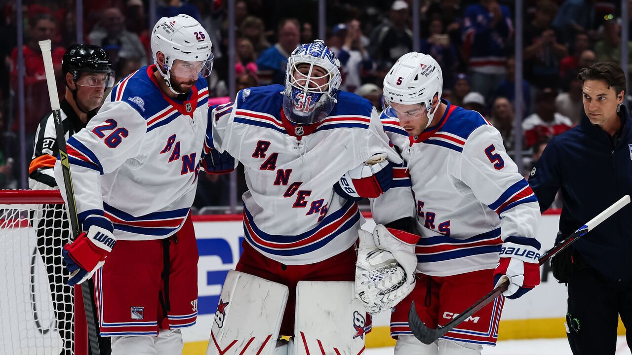 WASHINGTON, DC - OCTOBER 09: Igor Shesterkin #31 of the New York Rangers is helped of the ice after being injured on a play during the second period of the game against the Washington Capitals at Capital One Arena on October 9, 2026 in Washington, DC.