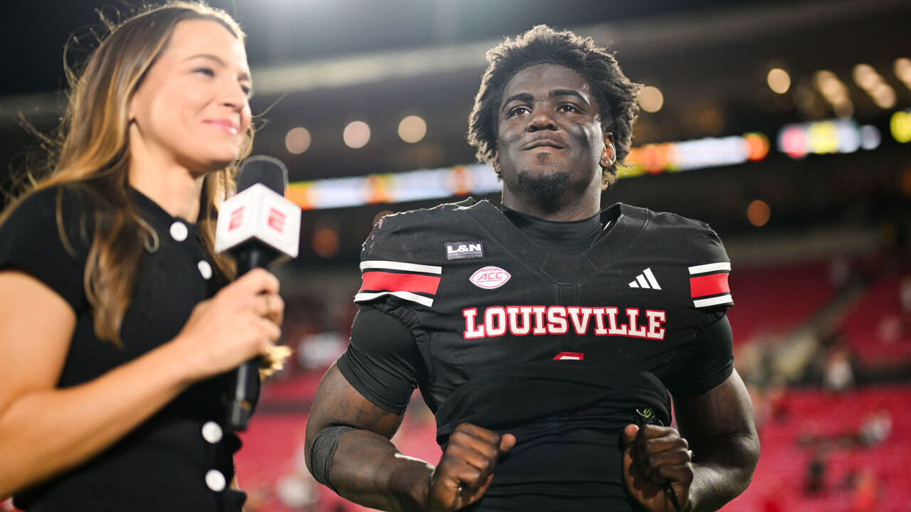 LOUISVILLE, KY - OCTOBER 09: Louisville Cardinals RB Isaac Brown (1) speaks with ESPN sideline reporter Dana Boyle following a college football game between the Florida State Seminoles and Louisville Cardinals on October 9, 2026 at L&N Federal Credit Union Stadium in Louisville, KY.