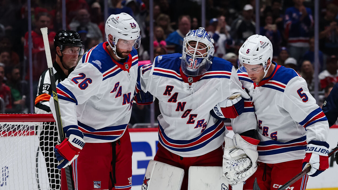 WASHINGTON, DC - OCTOBER 09: Igor Shesterkin #31 of the New York Rangers is helped of the ice after being injured on a play during the second period of the game against the Washington Capitals at Capital One Arena on October 9, 2026 in Washington, DC.