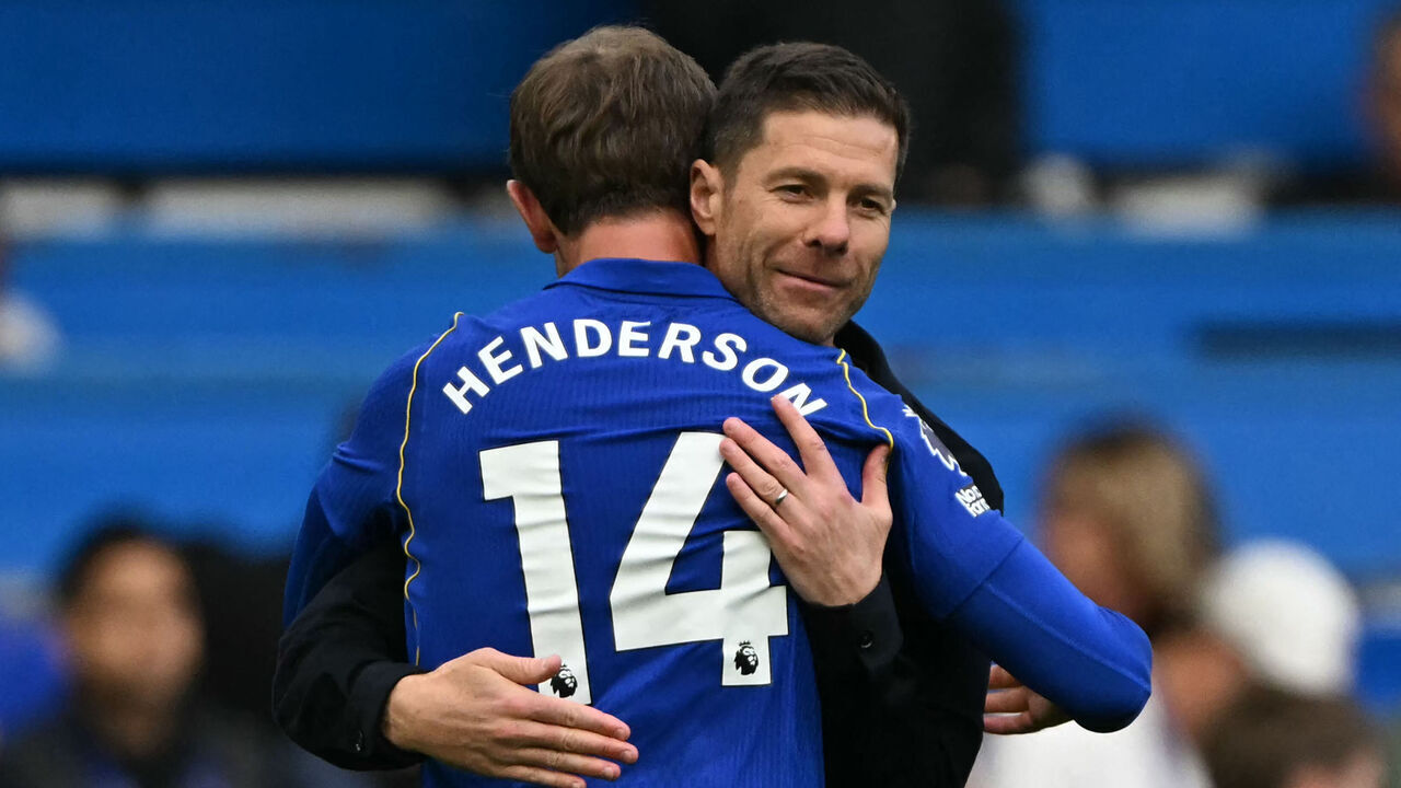 Chelsea's Spanish Manager Xabi Alonso (R) embraces Chelsea's English midfielder #14 Jordan Henderson on the pitch after the English Premier League football match between Chelsea and Bournemouth at Stamford Bridge in London on October 10, 2026. Chelsea won the game 5-1. / RESTRICTED TO EDITORIAL USE. No use with unauthorized audio, video, data, fixture lists, club/league logos or 'live' services. Online in-match use limited to 120 images. An additional 40 images may be used in extra time. No video emulation. Social media in-match use limited to 120 images. An additional 40 images may be used in extra time. No use in betting publications, games or single club/league/player publications. /