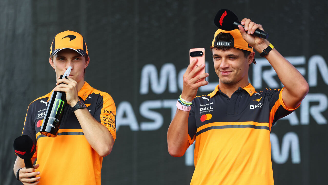 KUALA LUMPUR, MALAYSIA - OCTOBER 02: Oscar Piastri of Australia and McLaren and Lando Norris of Great Britain and McLaren on stage prior to practice ahead of the F1 Grand Prix of Bahrain in Malaysia at Sepang Circuit on October 02, 2026 in Kuala Lumpur, Malaysia.