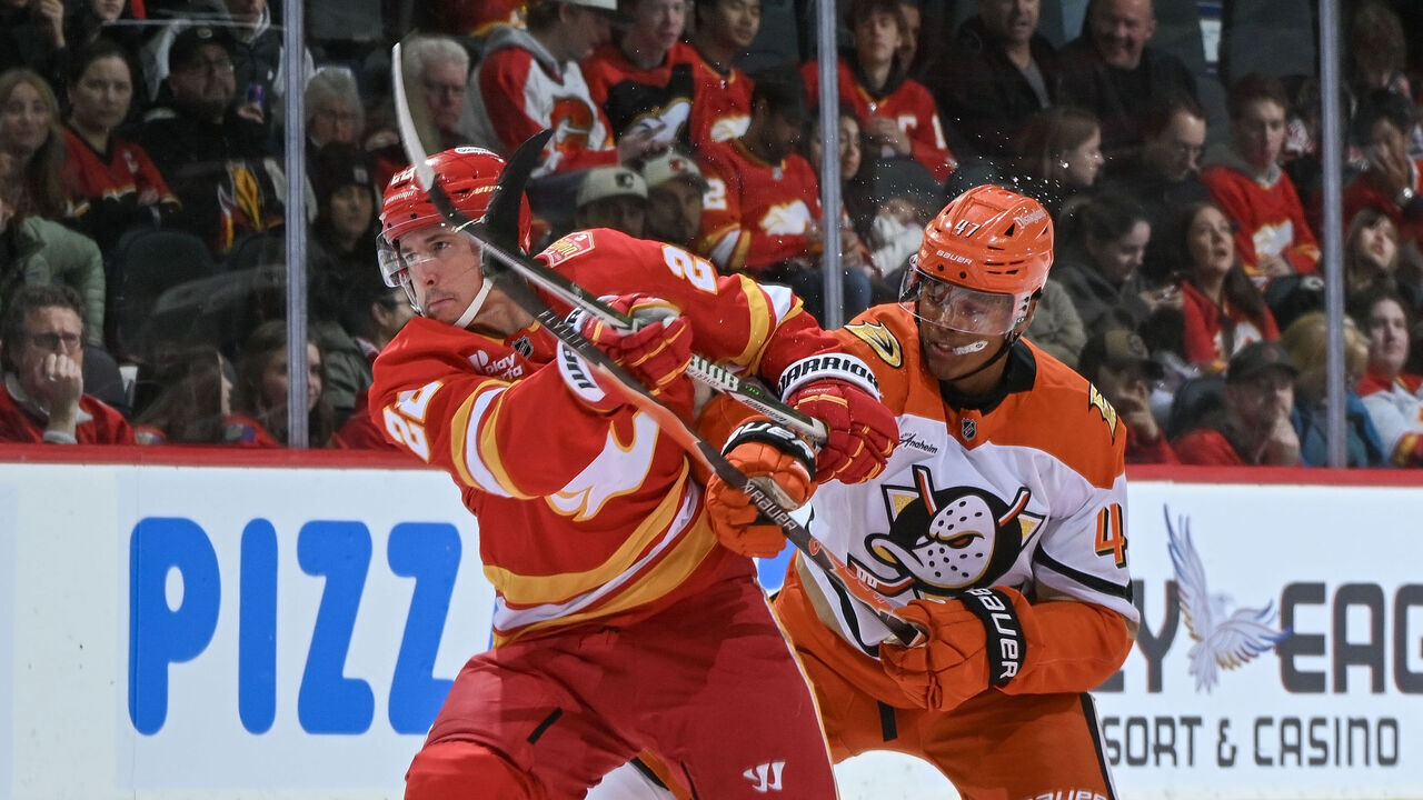 CALGARY, CANADA - OCTOBER 10: Ryan Strome #22 of the Calgary Flames skates against Noah Warren #47 of the Anaheim Ducks at Scotiabank Saddledome on October 10, 2026 in Calgary, Alberta, Canada.