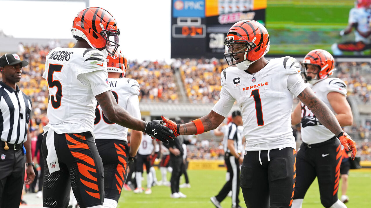PITTSBURGH, PENNSYLVANIA - SEPTEMBER 27: Tee Higgins #5 of the Cincinnati Bengals celebrates with teammate Ja'marr Chase #1 after scoring during the second quarter of an NFL football game against the Pittsburgh Steelers at Acrisure Stadium on September 27, 2026 in Pittsburgh, Pennsylvania.