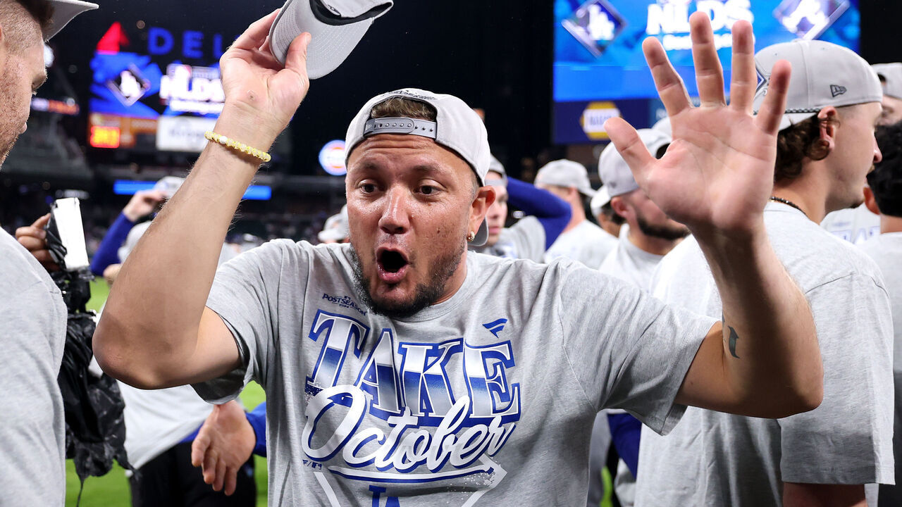 ATLANTA, GEORGIA - OCTOBER 07: Miguel Rojas #72 of the Los Angeles Dodgers celebrates defeating the Atlanta Braves in game four of the National League Division Series at Truist Park on October 07, 2026 in Atlanta, Georgia.