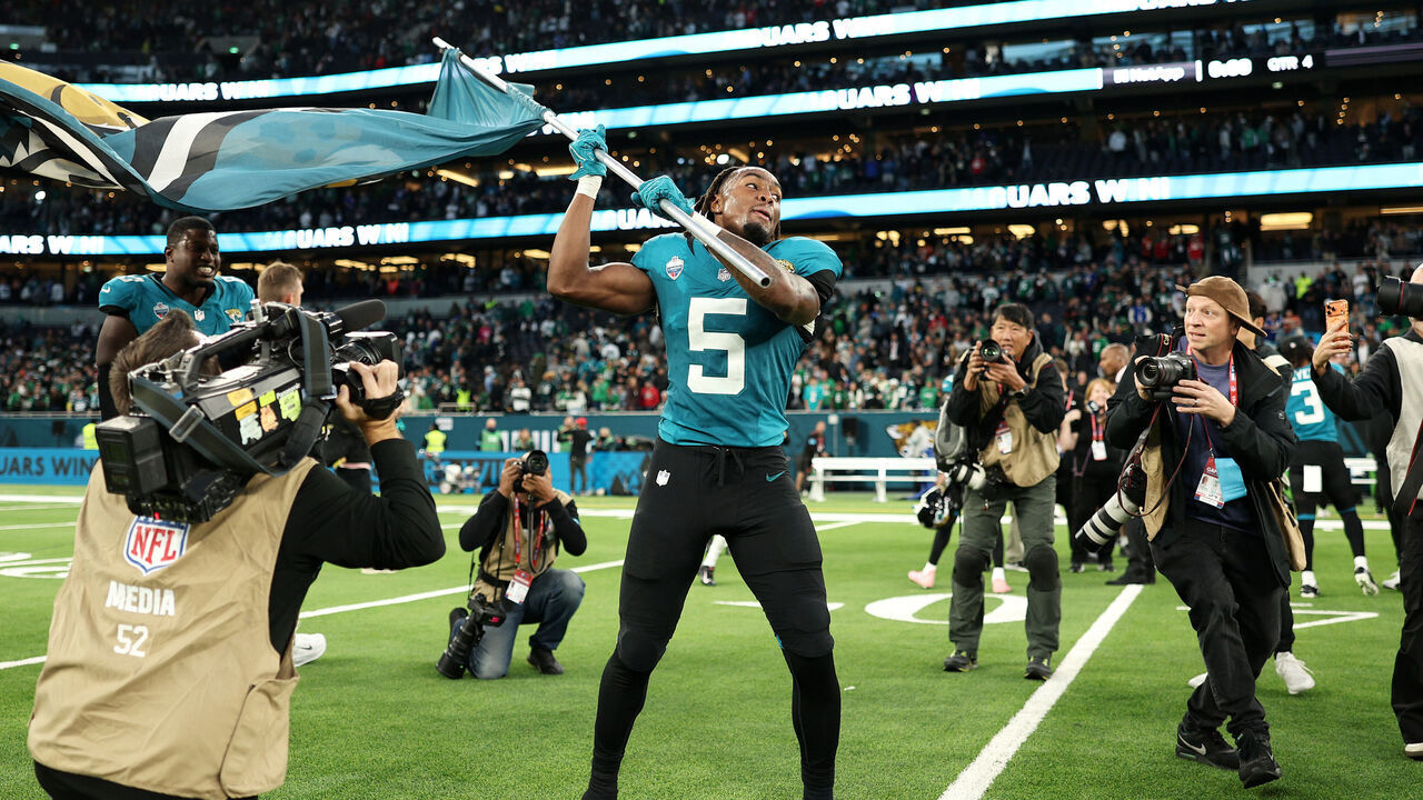 LONDON, ENGLAND - OCTOBER 11: LeQuint Allen Jr. of the Jacksonville Jaguars celebrates with a flag after the 2026 NFL London Games match between Philadelphia Eagles and Jacksonville Jaguars at Tottenham Hotspur Stadium on October 11, 2026 in London, England.