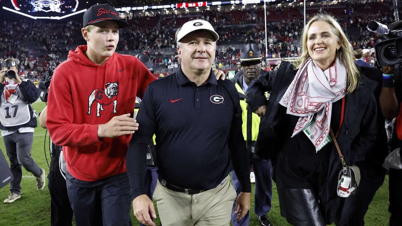 TUSCALOOSA, ALABAMA - OCTOBER 10: Head coach Kirby Smart of the Georgia Bulldogs walks off the field with his son, Andrew, and wife, Mary Beth, after his team's win over the Alabama Crimson Tide at Bryant Denny Stadium on October 10, 2026 in Tuscaloosa, Alabama.