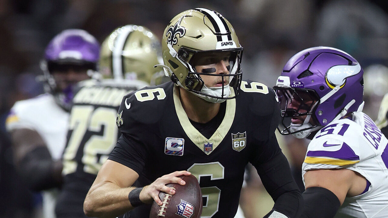 NEW ORLEANS, LOUISIANA - OCTOBER 11: Tyler Shough #6 of the New Orleans Saints scrambles under pressure from Blake Cashman #51 of the Minnesota Vikings during the first half at Caesars Superdome on October 11, 2026 in New Orleans, Louisiana.