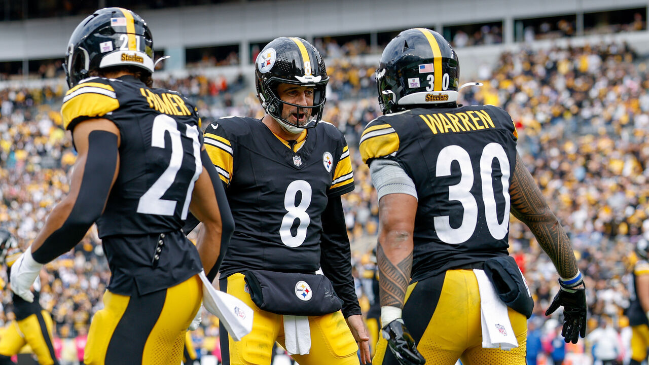 PITTSBURGH, PENNSYLVANIA - OCTOBER 11: Aaron Rodgers #8 and Jaylen Warren #30 of the Pittsburgh Steelers celebrate during the third quarter of the game against the Indianapolis Colts at Acrisure Stadium on October 11, 2026 in Pittsburgh, Pennsylvania.