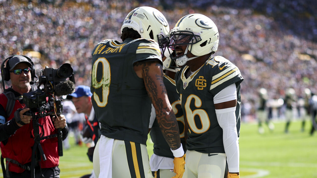 GREEN BAY, WISCONSIN - OCTOBER 11: Christian Watson #9 of the Green Bay Packers celebrates with teammates after scoring a touchdown during the first quarter of the NFL football game against the Chicago Bears at Lambeau Field on October 11, 2026 in Green Bay, Wisconsin.