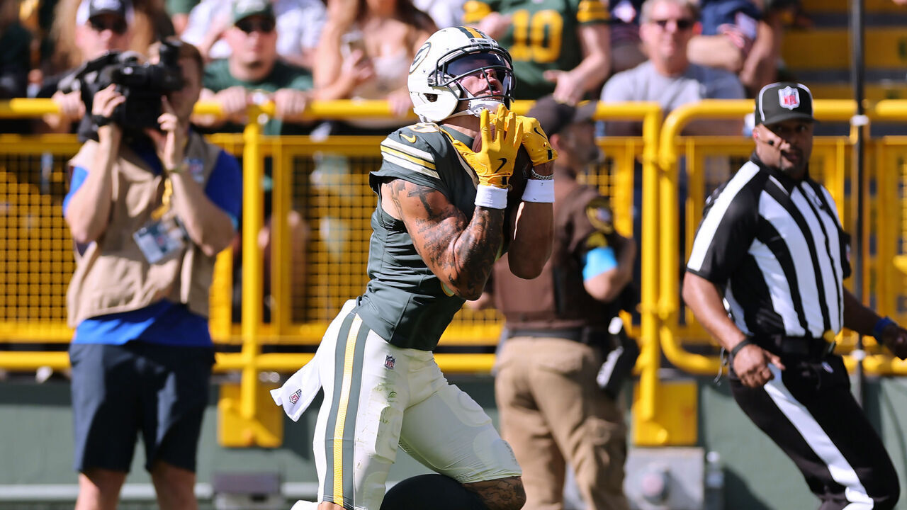 GREEN BAY, WISCONSIN - OCTOBER 11: Christian Watson #9 of the Green Bay Packers catches a pass for a touchdown against the Chicago Bears during the first quarter at Lambeau Field on October 11, 2026 in Green Bay, Wisconsin.