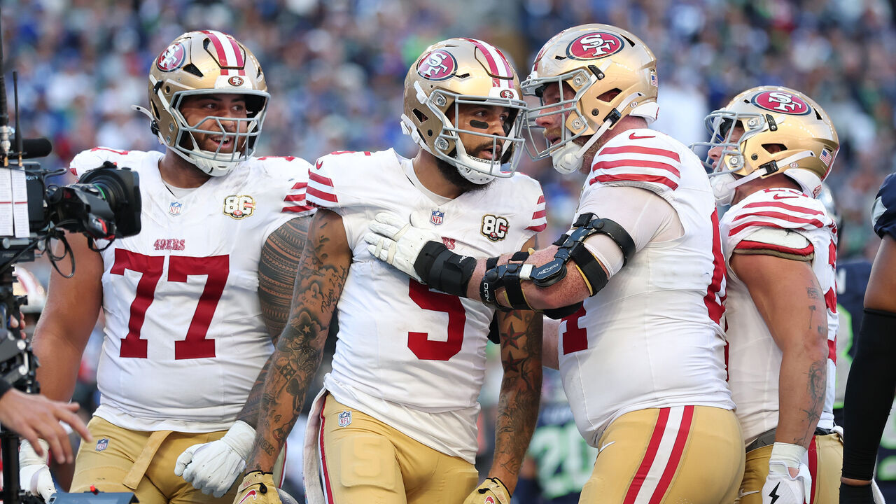 SEATTLE, WASHINGTON - OCTOBER 11: Mike Evans #5 of the San Francisco 49ers celebrates with Jake Brendel #64 after scoring a two-point conversion against the Seattle Seahawks during the fourth quarter at Lumen Field on October 11, 2026 in Seattle, Washington.