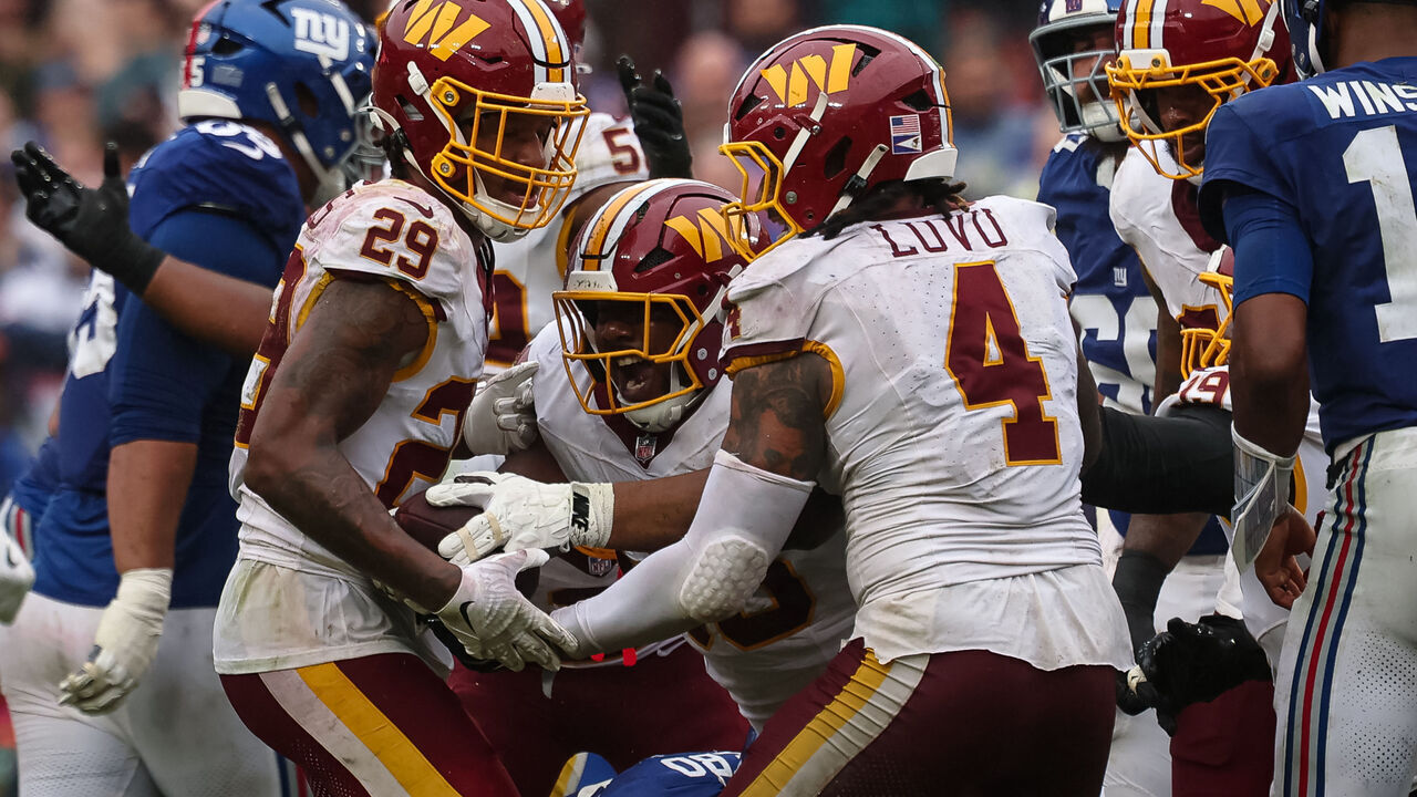 LANDOVER, MARYLAND - OCTOBER 11: Shy Tuttle #96 of the Washington Commanders celebrates after recovering a fumble during overtime in the NFL game against the New York Giants at Northwest Stadium on October 11, 2026 in Landover, Maryland.