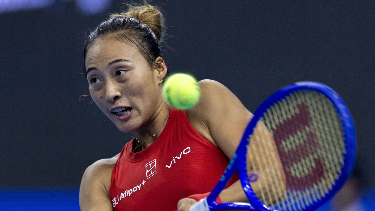 BEIJING, CHINA - OCTOBER 11: Zheng Qinwen of China returns a shot against Mirra Andreeva during the Women's Singles final match on day 12 of China Open at the National Tennis Center on October 11, 2026 in Beijing, China.