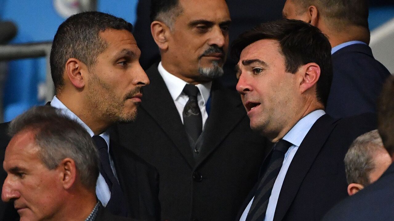 Manchester City Emirati chairman Khaldoon al-Mubarak (L) talks with Greater Manchester Mayor Andy Burnham the Vincent Kompany testimonial football match between the Manchester City Legends and the Premier League All-stars XI at the Etihad Stadium in Manchester, northwest England, on September 11, 2019.