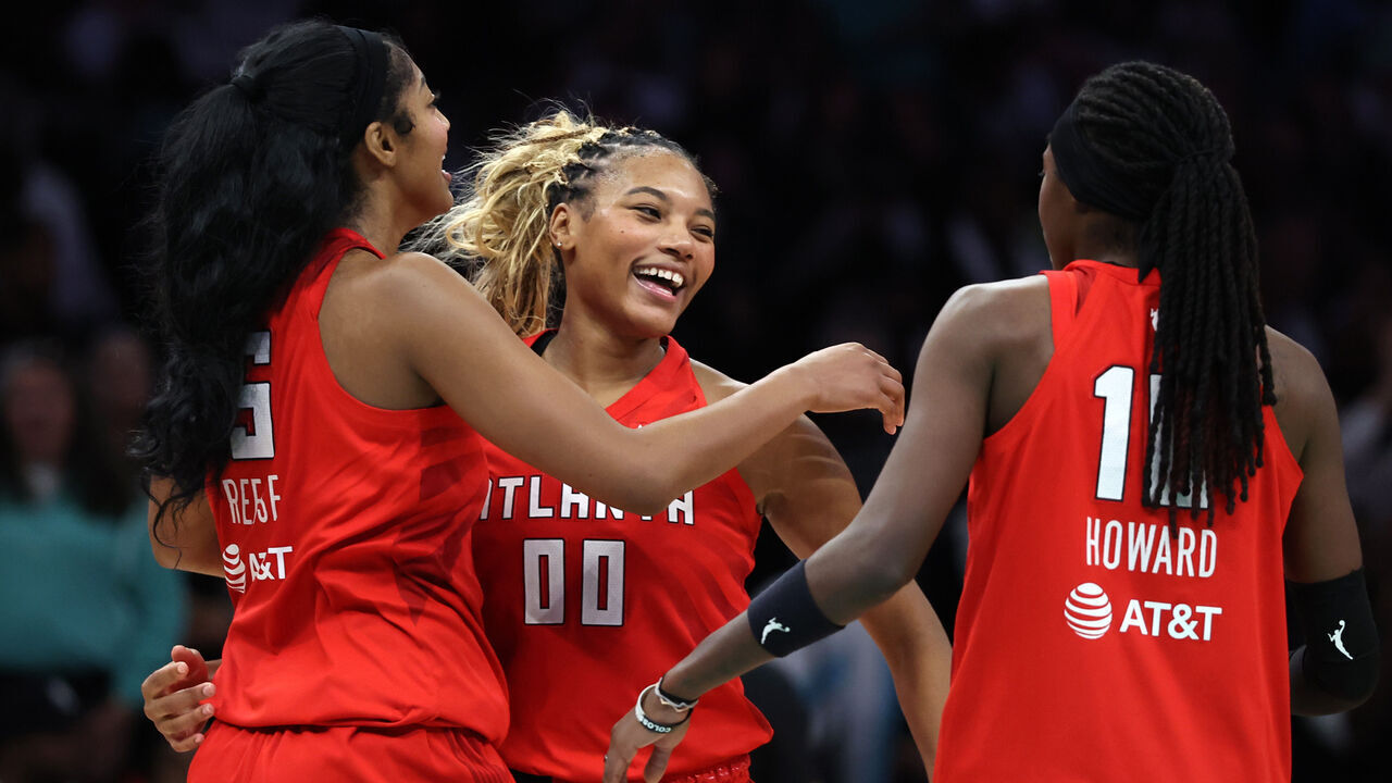 NEW YORK, NEW YORK - OCTOBER 09: Naz Hillmon #00, Angel Reese #5, and Rhyne Howard #10 of the Atlanta Dream celebrate after defeating the New York Liberty in game three of the SemiFinals of the WNBA Playoffs at Barclays Center on October 09, 2026 in New York City.