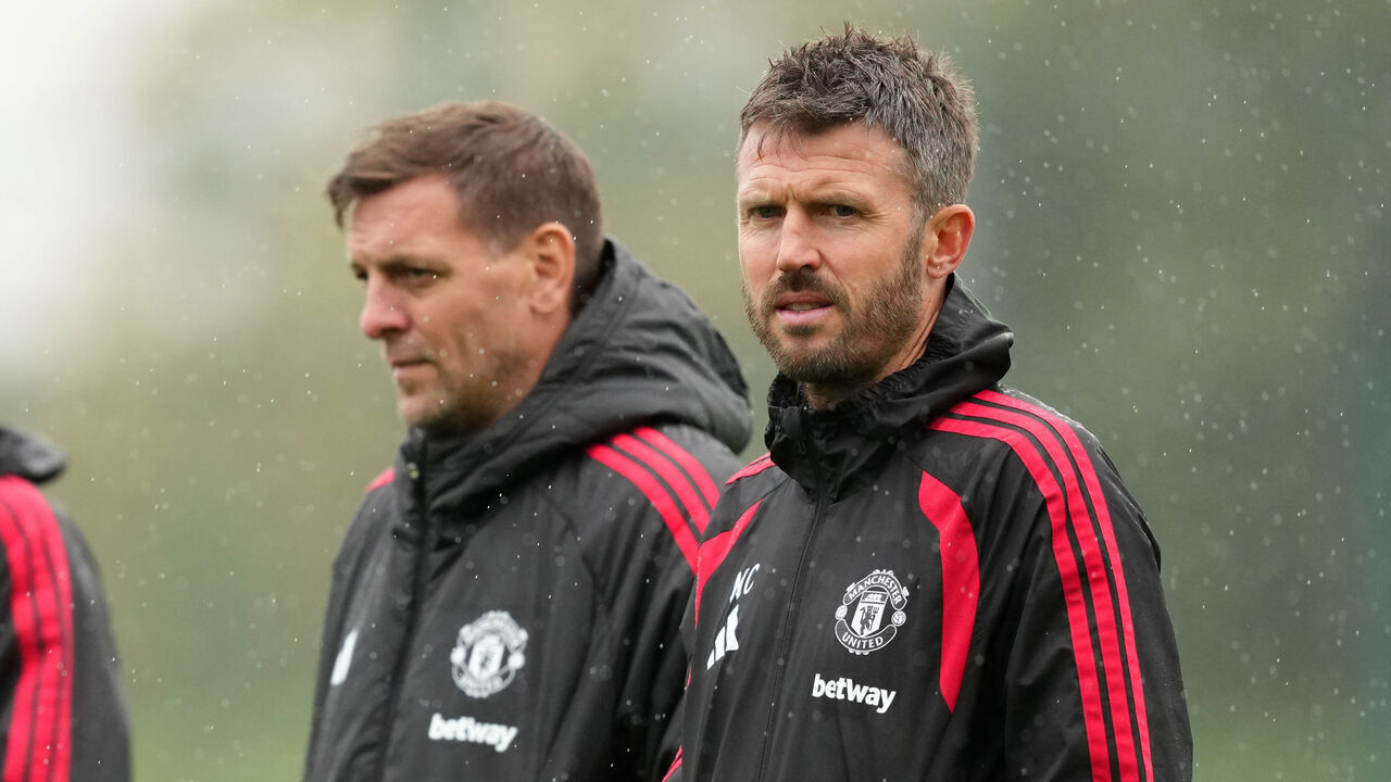 Manchester United manager Michael Carrick (right) with coaches Jonny Evans (left) and Jonathan Woodgate during a training session at Carrington Training Centre, Manchester. Picture date: Monday October 12, 2026.