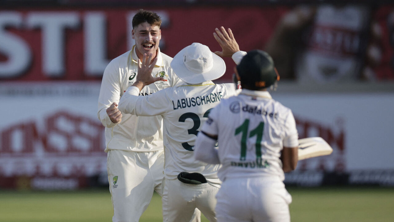 Australia's Matt Renshaw (L) celebrates after dismissing South Africa's Temba Bavuma (R) on day four of the first Test match between South Africa and Australia at the Kingsmead stadium in Durban on October 12, 2026.