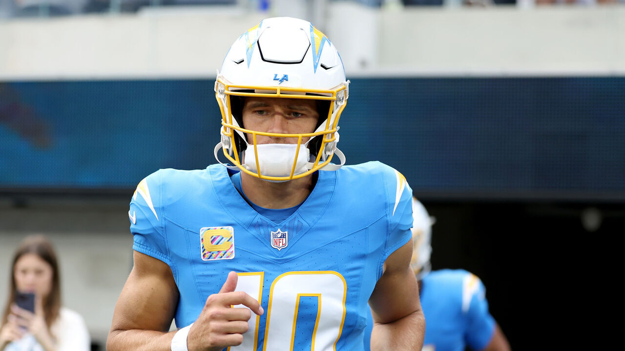 INGLEWOOD, CALIFORNIA - OCTOBER 11: Justin Herbert #10 of the Los Angeles Chargers jogs onto the field prior to the game against the Denver Broncos at SoFi Stadium on October 11, 2026 in Inglewood, California.