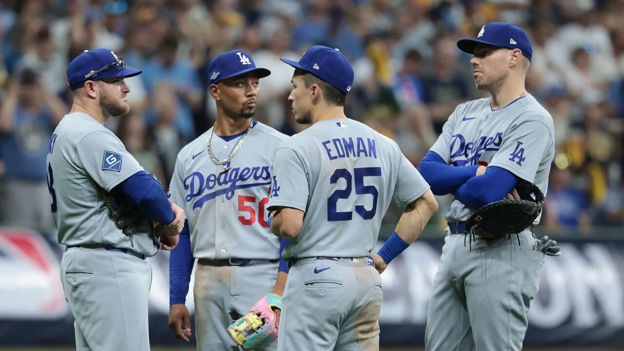 Mookie Betts, Milwaukee, WI - October 12, 2026: Los Angeles Dodgers infielders Max Muncy, Tommy Edman and Freddeie Freeman meet during a pitching change. The LA Dodgers play the Milwaukee Brewers in game two of the National League Championship Series at American Family Field, Milwaukee, WI on Monday, Oct. 12, 2026. (Robert Gauthier/Los Angeles Times via Getty Images)