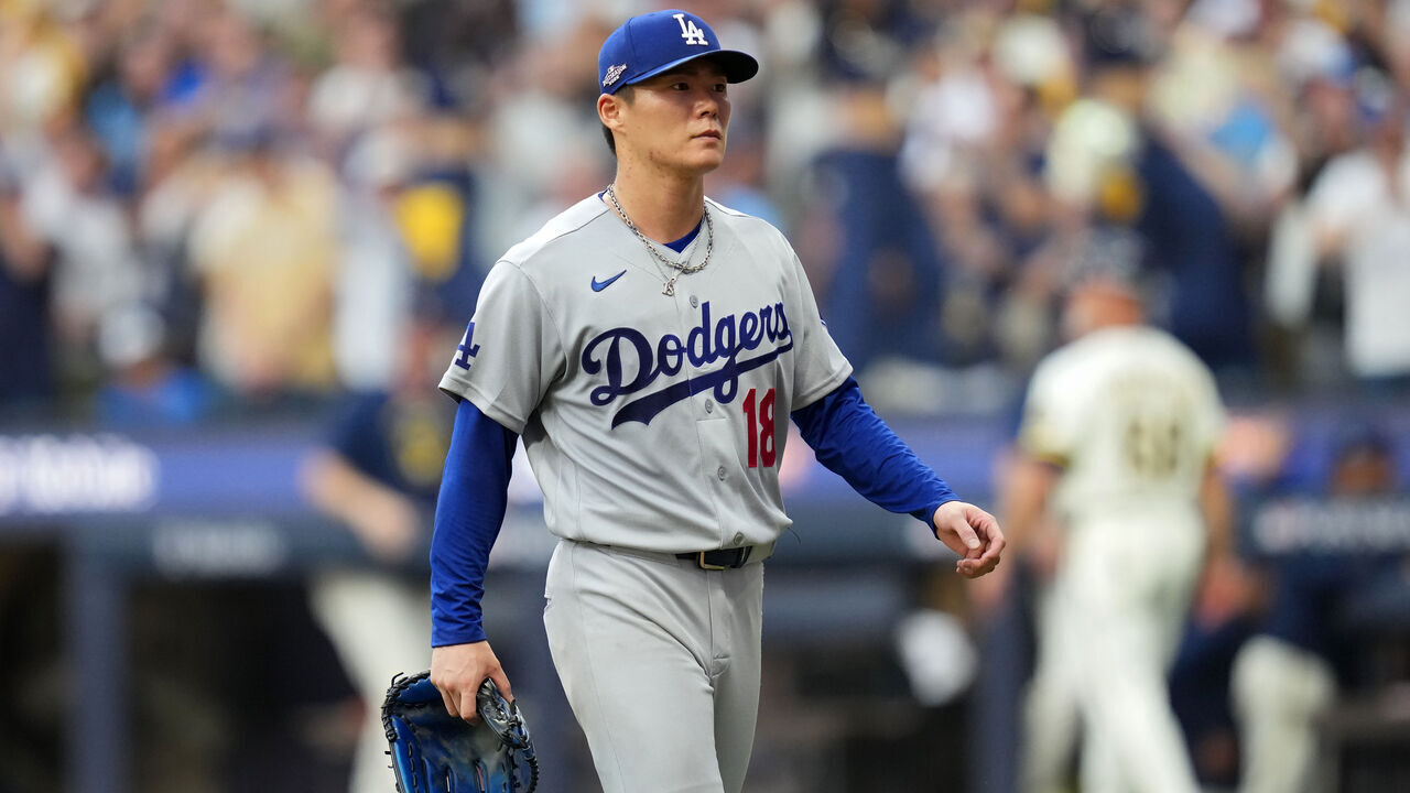 MILWAUKEE, WISCONSIN - OCTOBER 12: Yoshinobu Yamamoto #18 of the Los Angeles Dodgers walks off the field after being relieved in the third inning against the Milwaukee Brewers in game two of the National League Championship Series at American Family Field on October 12, 2026 in Milwaukee, Wisconsin.