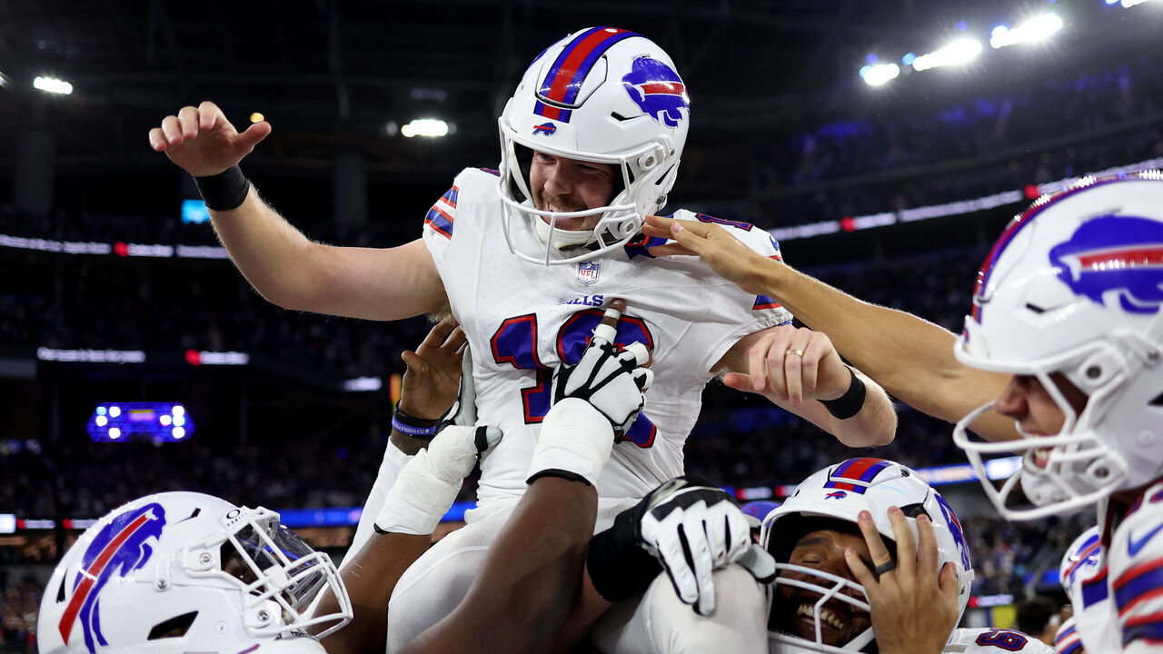 INGLEWOOD, CALIFORNIA - OCTOBER 12: Tyler Bass #16 of the Buffalo Bills celebrates with teammates after kicking a 45 yard game winning field goal against the Los Angeles Rams in overtime of the game at SoFi Stadium on October 12, 2026 in Inglewood, California.